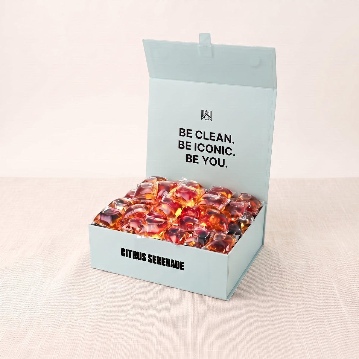 Citrus Serenade laundry pods box, open, on linen