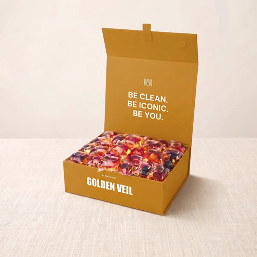 Golden Veil laundry pods box, open, on linen